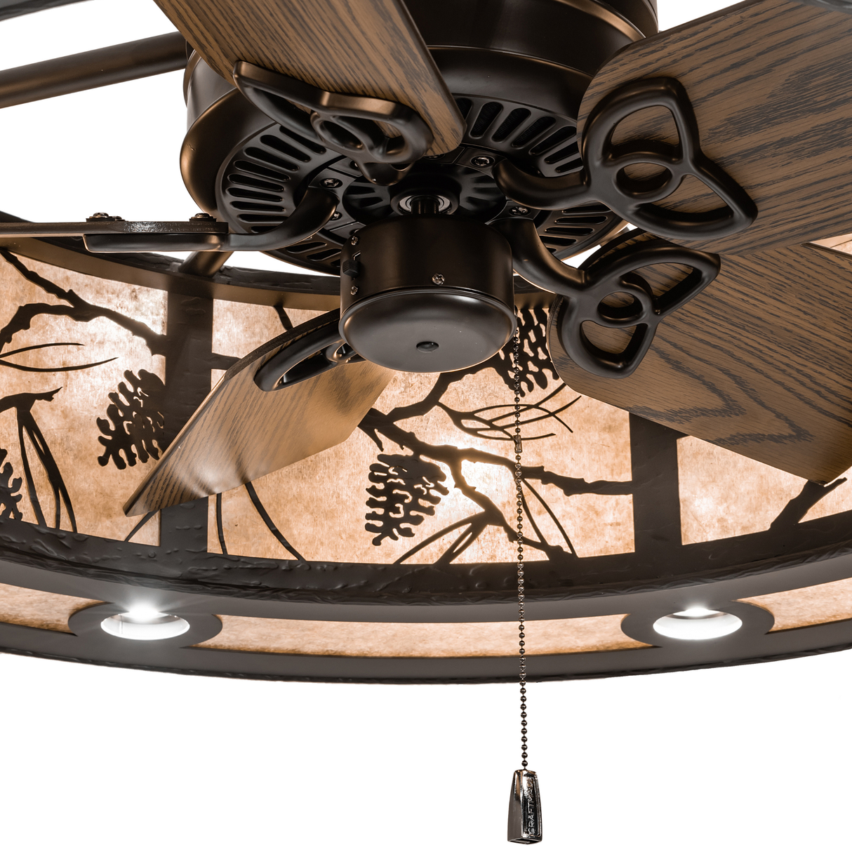 Detail view highlighting intricate bronze cutouts and softly lit mica surface.