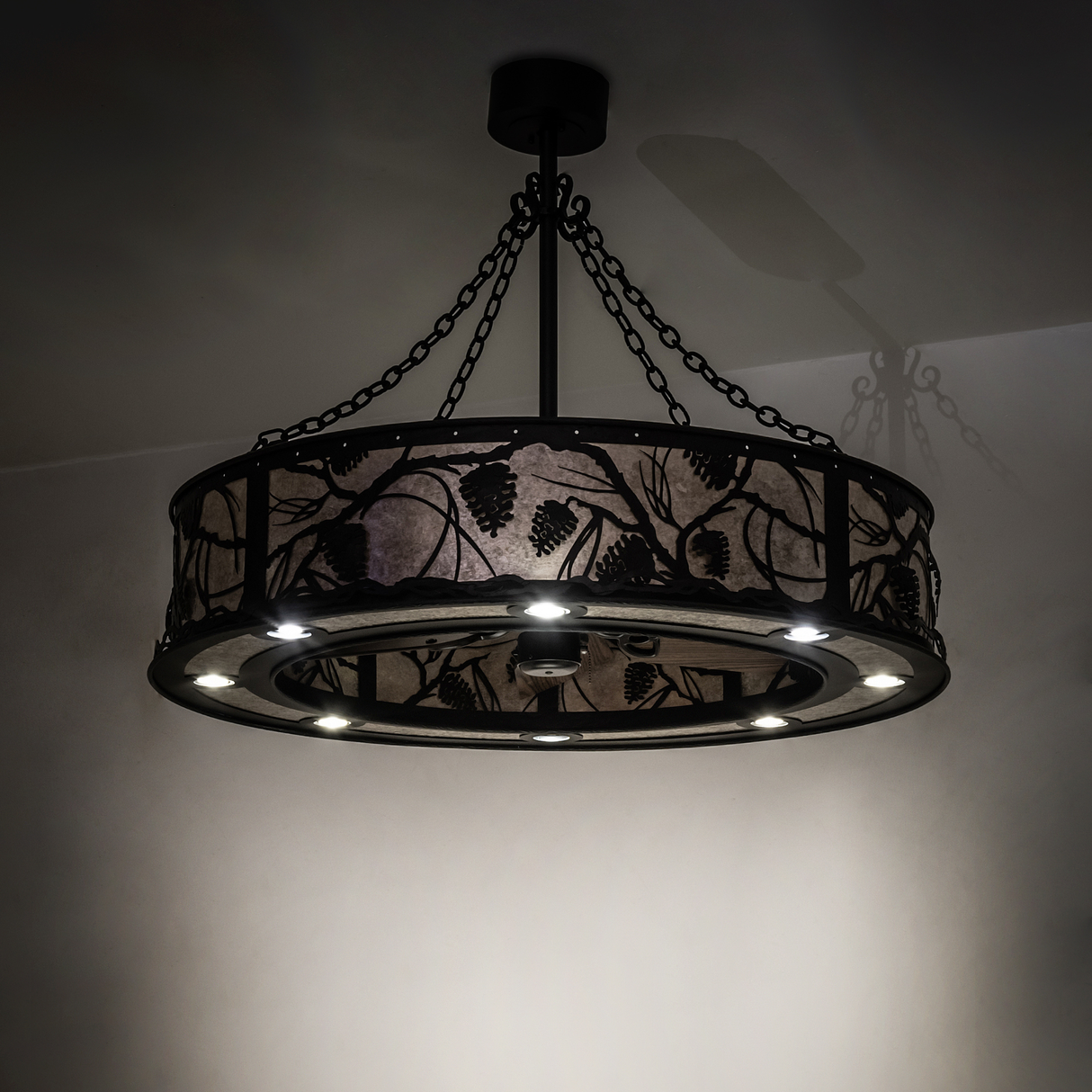 Dimly lit ambient view showcasing pine branch silhouette on mica diffuser.