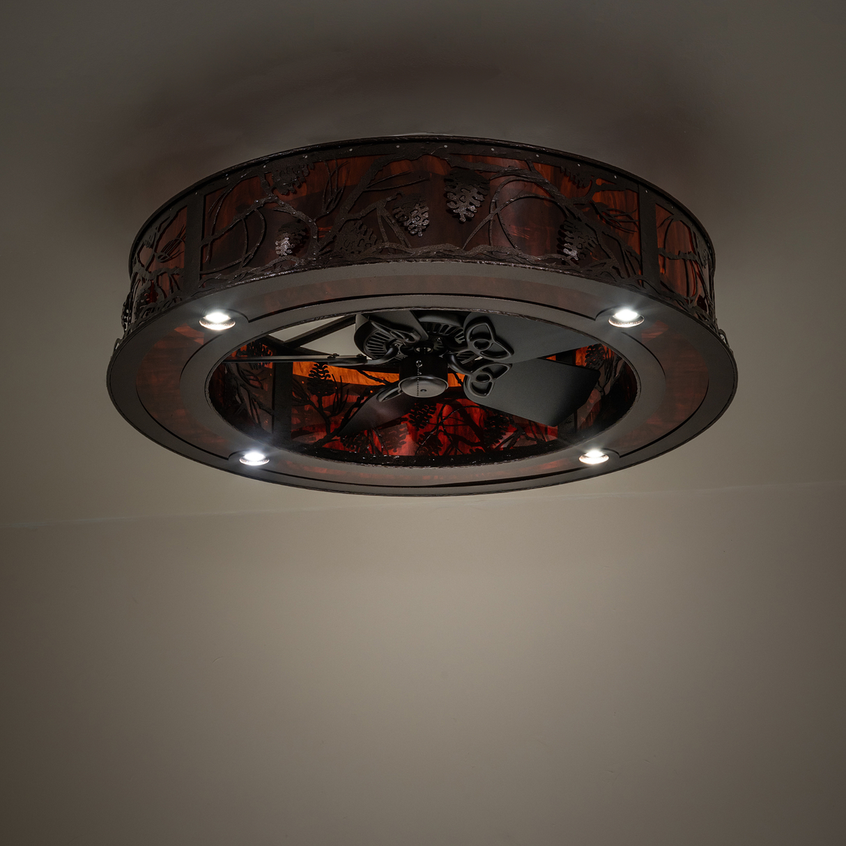 Dimly lit Whispering Pines chandelier showing downlights and fan view.