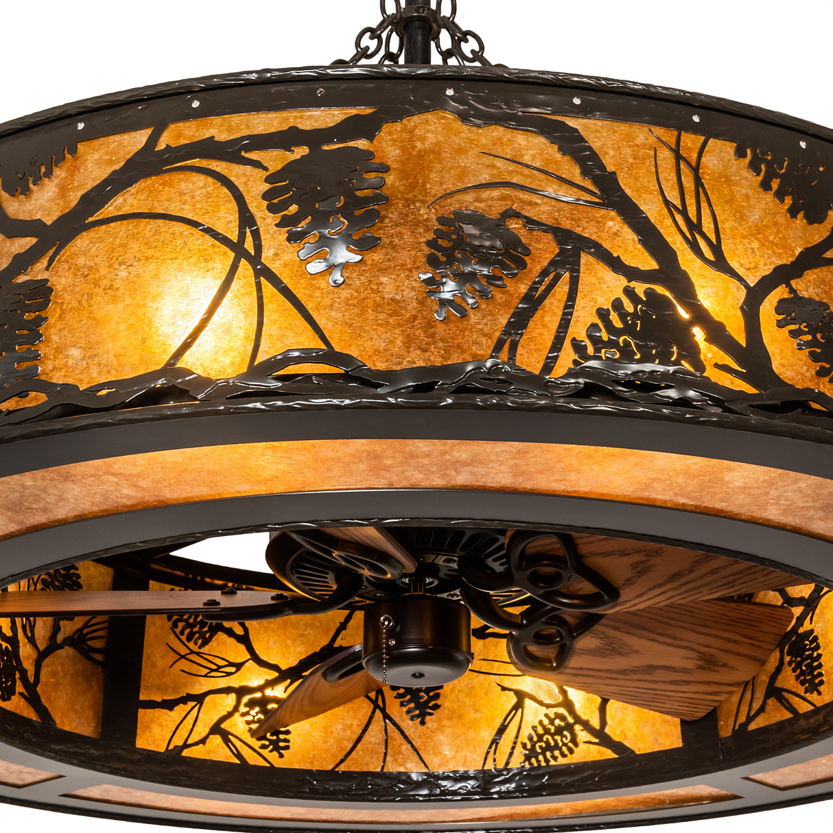 Close-up of fan beneath softly glowing mica and metalwork.