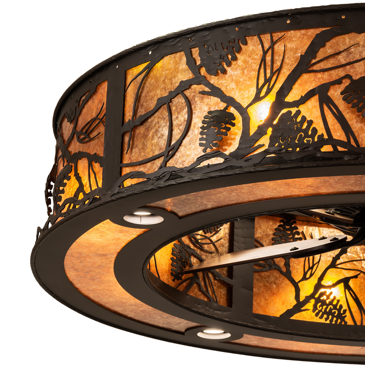 Close-up of pinecone metalwork and amber mica on Whispering Pines Chandel-Air.