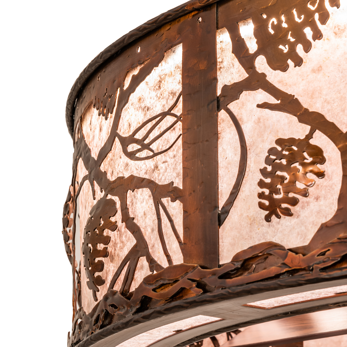 Close-up of pinecone and branch metalwork on Whispering Pines Chandel-Air.