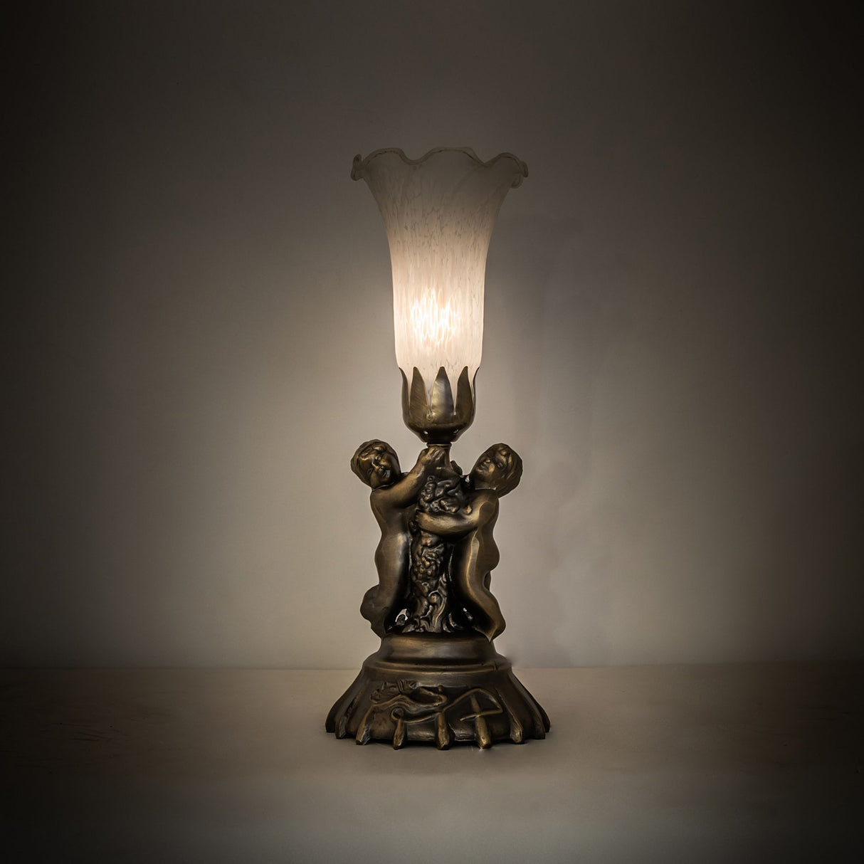 Ambient lighting view of Tiffany Pond Lily lamp casting a soft glow.