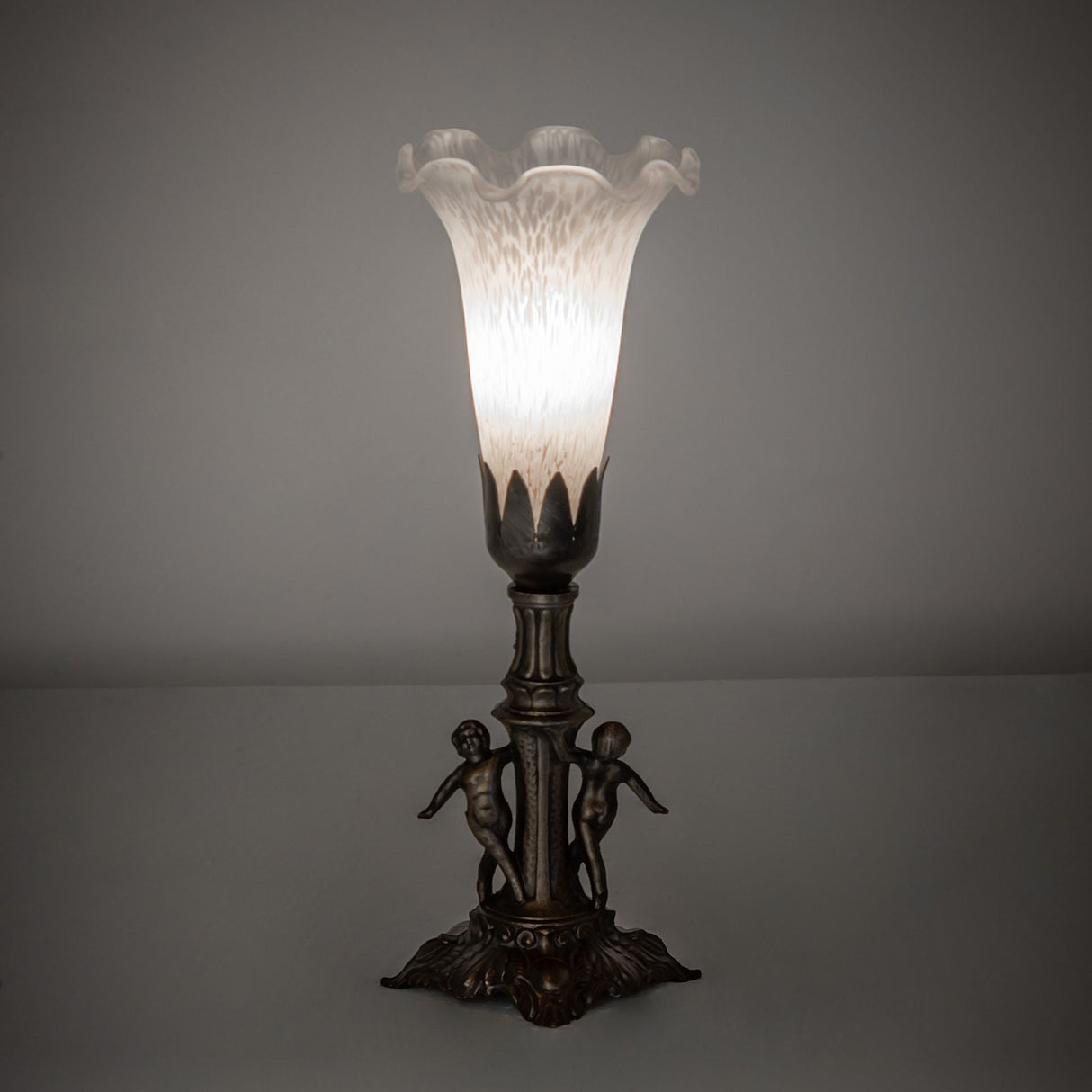 White Tiffany Pond Lily Mini Lamp illuminated in an ambient setting.
