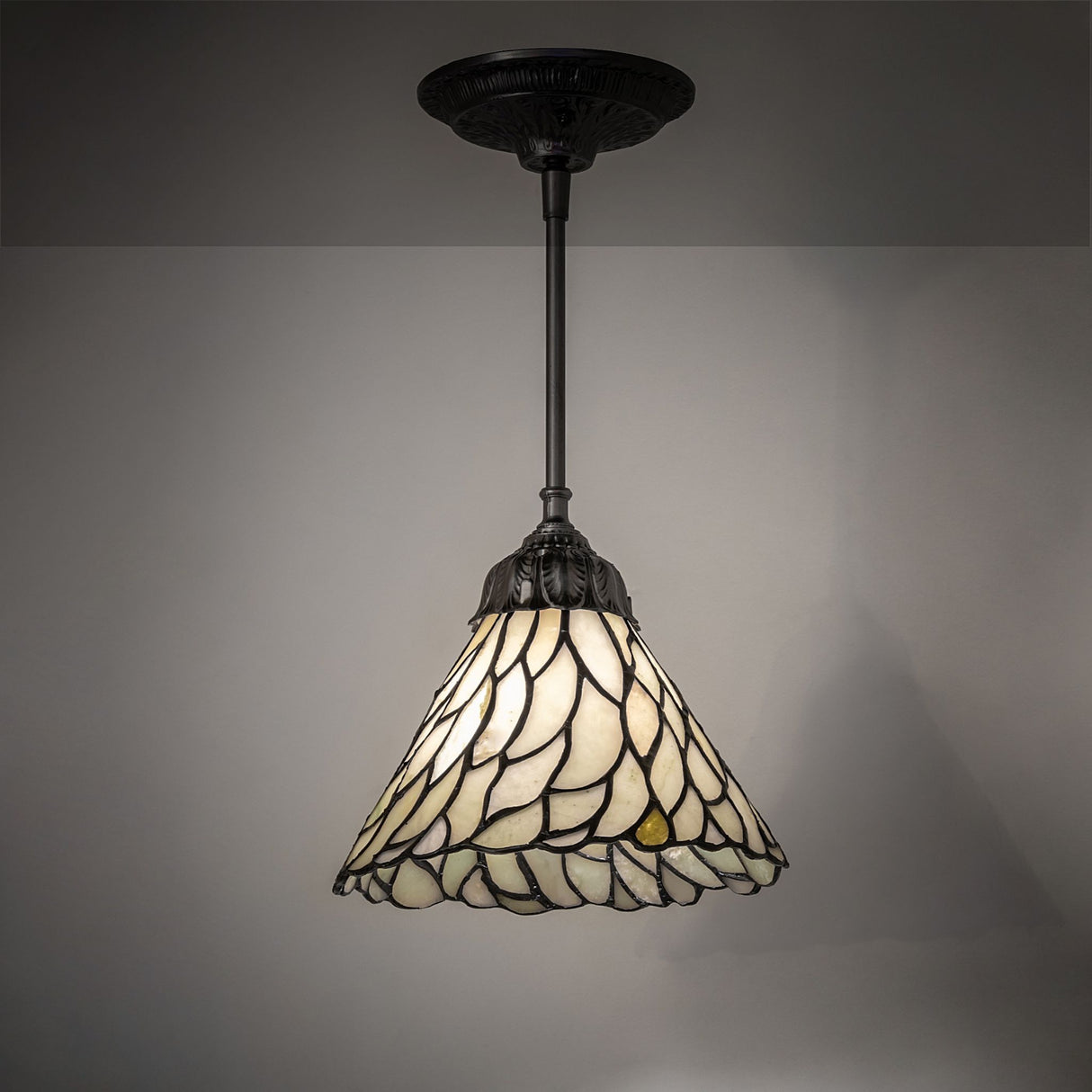 Illuminated Willow Jadestone Mini Pendant with warm tones.