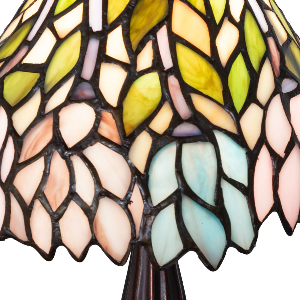 A detailed close-up of the Wisteria Mini Lamp's art glass shade highlighting its mosaic design.