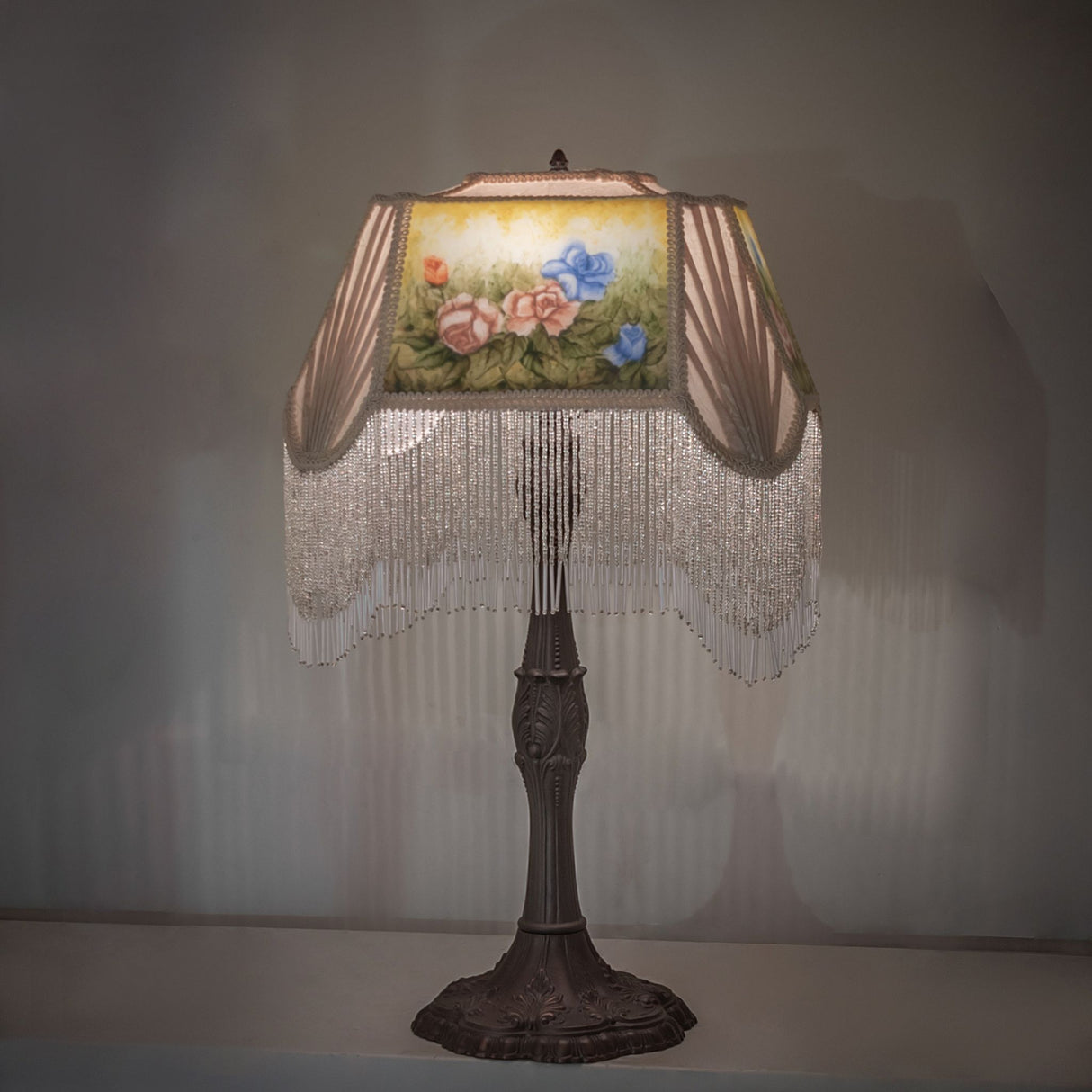 Ambient lighting of reverse-painted roses table lamp.