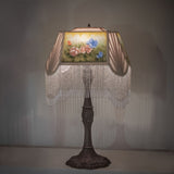 Ambient lighting of reverse-painted roses table lamp.