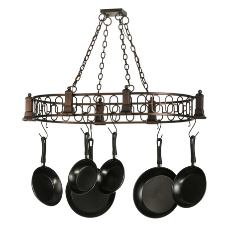 Angled view showing oval frame and hanging pans on chandelier.