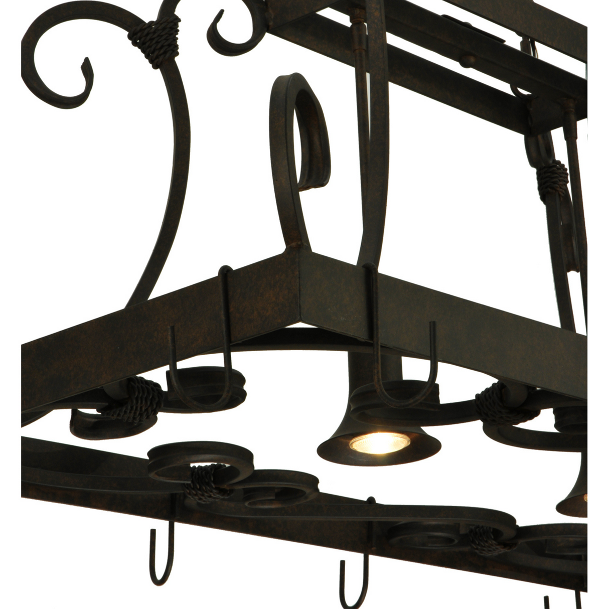 Close-up of downlight softly illuminating pot rack surface.