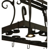 Close-up of downlight softly illuminating pot rack surface.