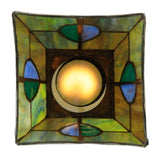 Downward view of glowing stained glass shade with Mackintosh details.