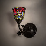 Red rosebud wall sconce illuminated, showcasing its vibrant stained-glass design.