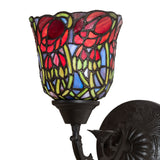 Close-up of the wrought iron base of the red rosebud wall sconce.