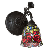 Fully lit view of the 6" wide red rosebud wall sconce with glowing stained glass.
