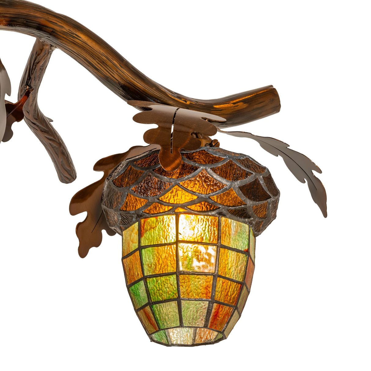 Close-up detail of small stained glass acorn shade and leaf metalwork.