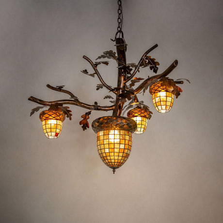 Acorn 4 light chandelier glowing in an ambient room setting.