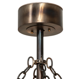 Close-up of canopy and hanging chains in burnished copper finish.