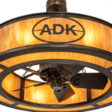 Close-up of ADK logo and bronze frame over glowing amber diffuser.