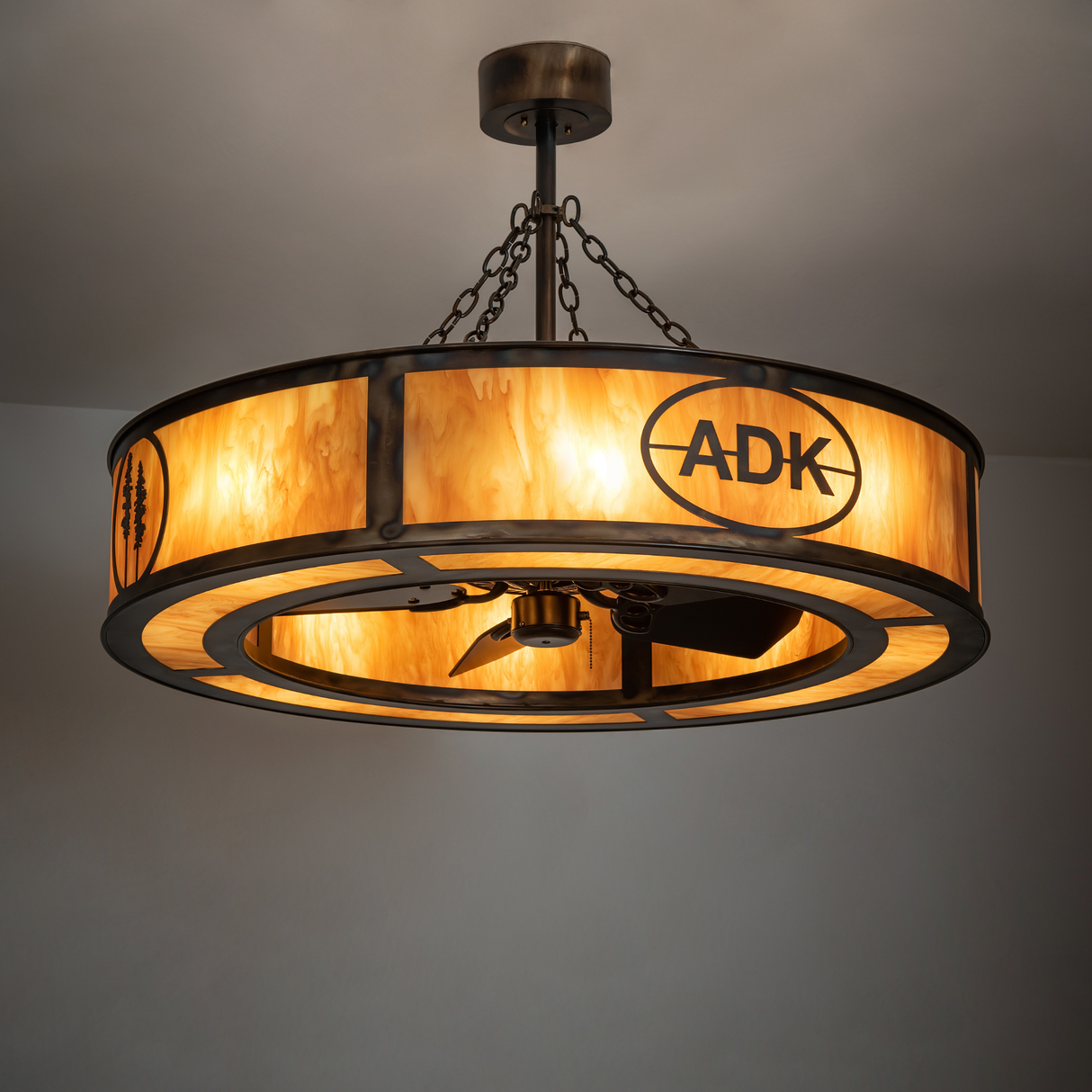 Warm lit view of Adirondack Bank Chandel-Air enhancing interior ambiance.