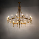 Gold Amaury chandelier illuminated in an interior setting, showcasing soft ambient light and elegant scale.