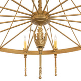 Close-up of chandelier center hub with decorative gold leaf accent and radial metal spokes.
