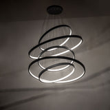 Anillo five-ring cascading chandelier creating dramatic ambient LED lighting effect.