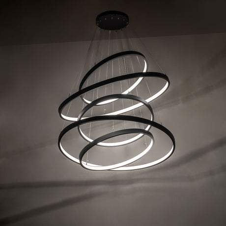 Anillo five-ring cascading chandelier creating dramatic ambient LED lighting effect.