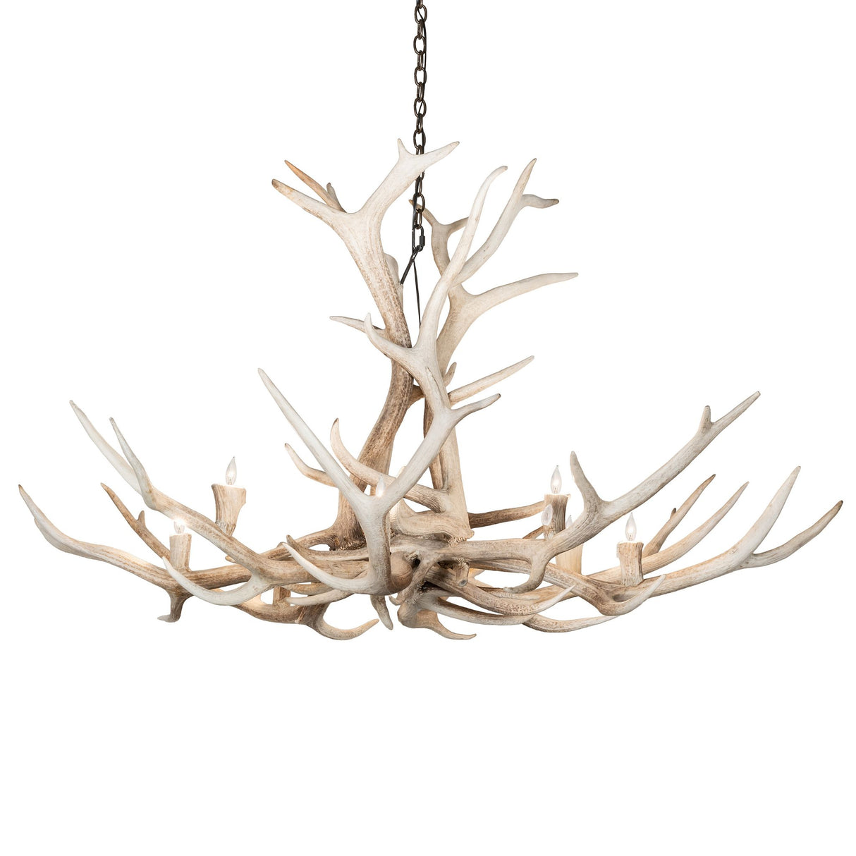 Lit view of Elk antler chandelier glowing with warm candle-style bulbs.