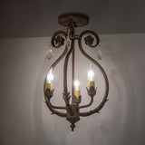 Ambient view of chandelier, highlighting crystal accents, floral details, and warm antiquity finish.