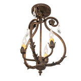 Bottom angle view of chandelier showing tapered finial and underside of scrolled framework.
