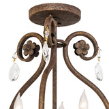 Close-up of canopy showing crystal drops, floral scrollwork, and textured antiquity metal finish.