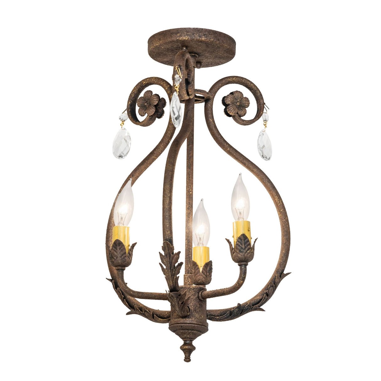 Lit view of chandelier with antiquity finish, scrolled arms, crystal drops, and ivory candle-style bulbs.
