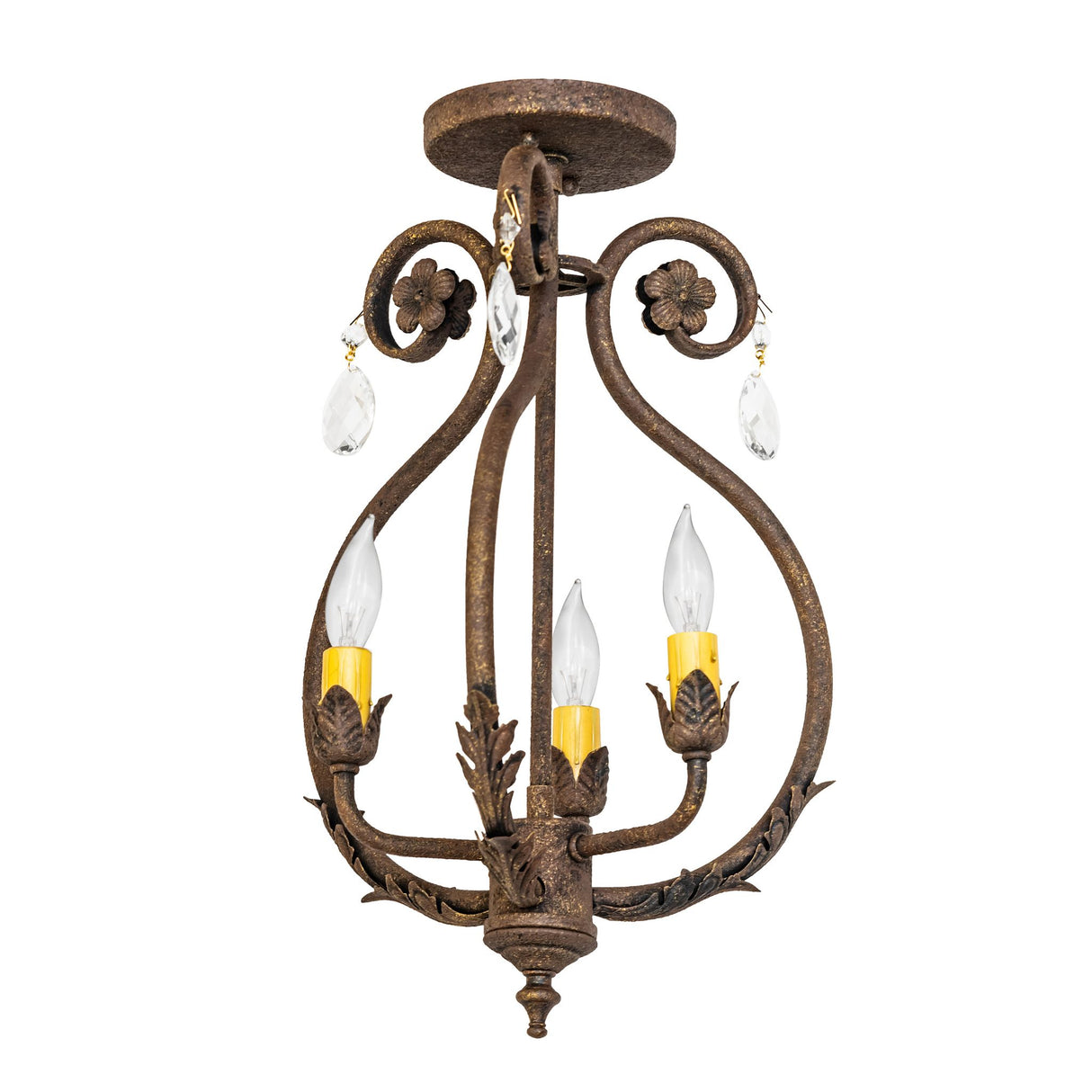 Unlit view of chandelier showing ornate scrollwork, acanthus leaves, and faceted crystal ornaments.