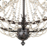 Lower detail of chandelier with crystal strands and decorative finial.