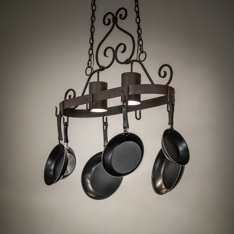 Argus pot rack chandelier glowing in rustic kitchen.