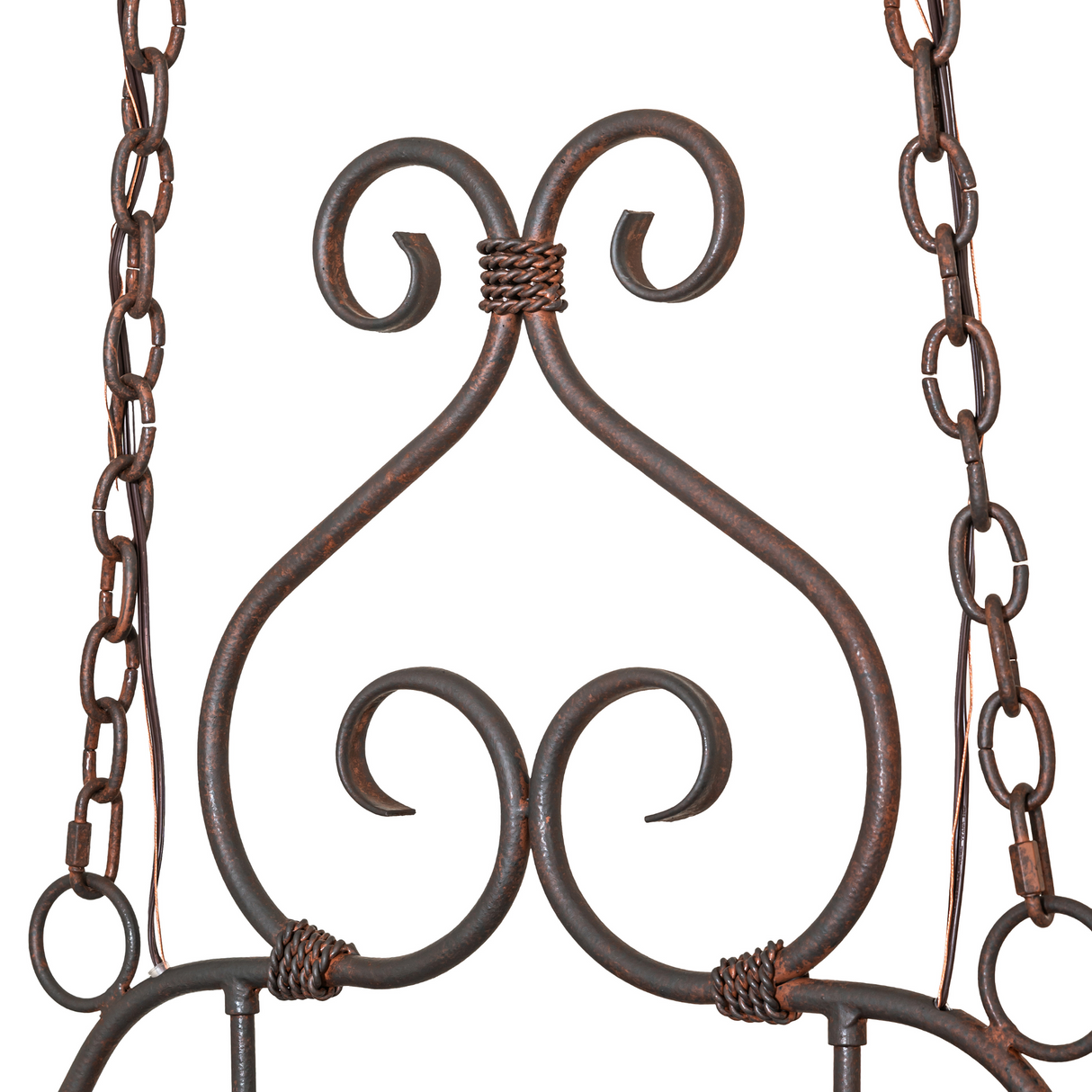Close-up of scrollwork and chain details.