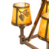 Close-up of amber mica shade with pinecone and needle design.