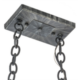Ceiling canopy and chain detail of farmhouse pot rack chandelier.
