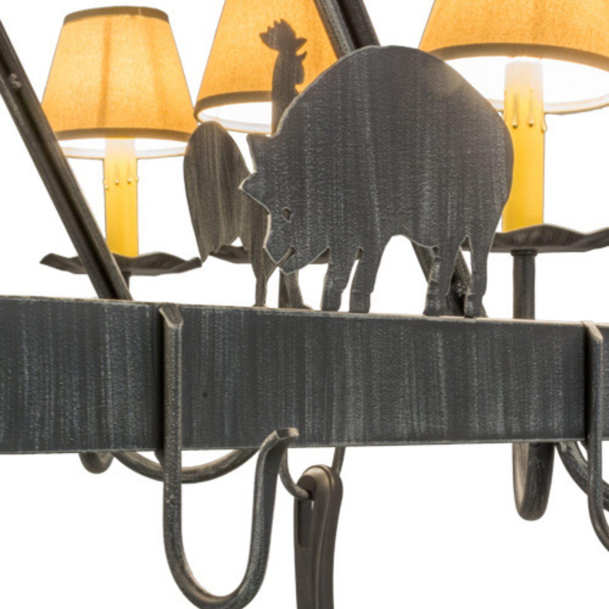 Close-up of pig silhouette on rustic barn animal chandelier.