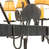 Close-up of pig silhouette on rustic barn animal chandelier.