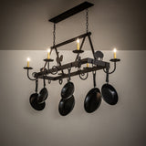Barn animals chandelier glowing in rustic kitchen space.