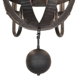 Closeup view of chandelier showing charred wood staves, metal bands, and orb finial detail.