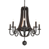 Lit view of chandelier with charred wood staves, black metal arms, and glowing candle bulbs.