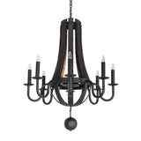 Unlit view of chandelier highlighting charred wood bands, curved metal arms, and orb accent.