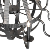 Detailed view of candlelight with holder and hammered metal bands.