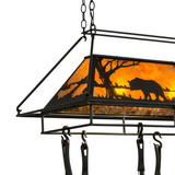 Close-up side view of Bear at Lake pot rack glowing amber light.