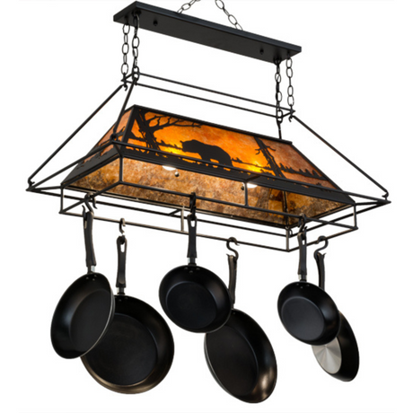 Handcrafted Bear at Lake chandelier pot rack glowing in kitchen.