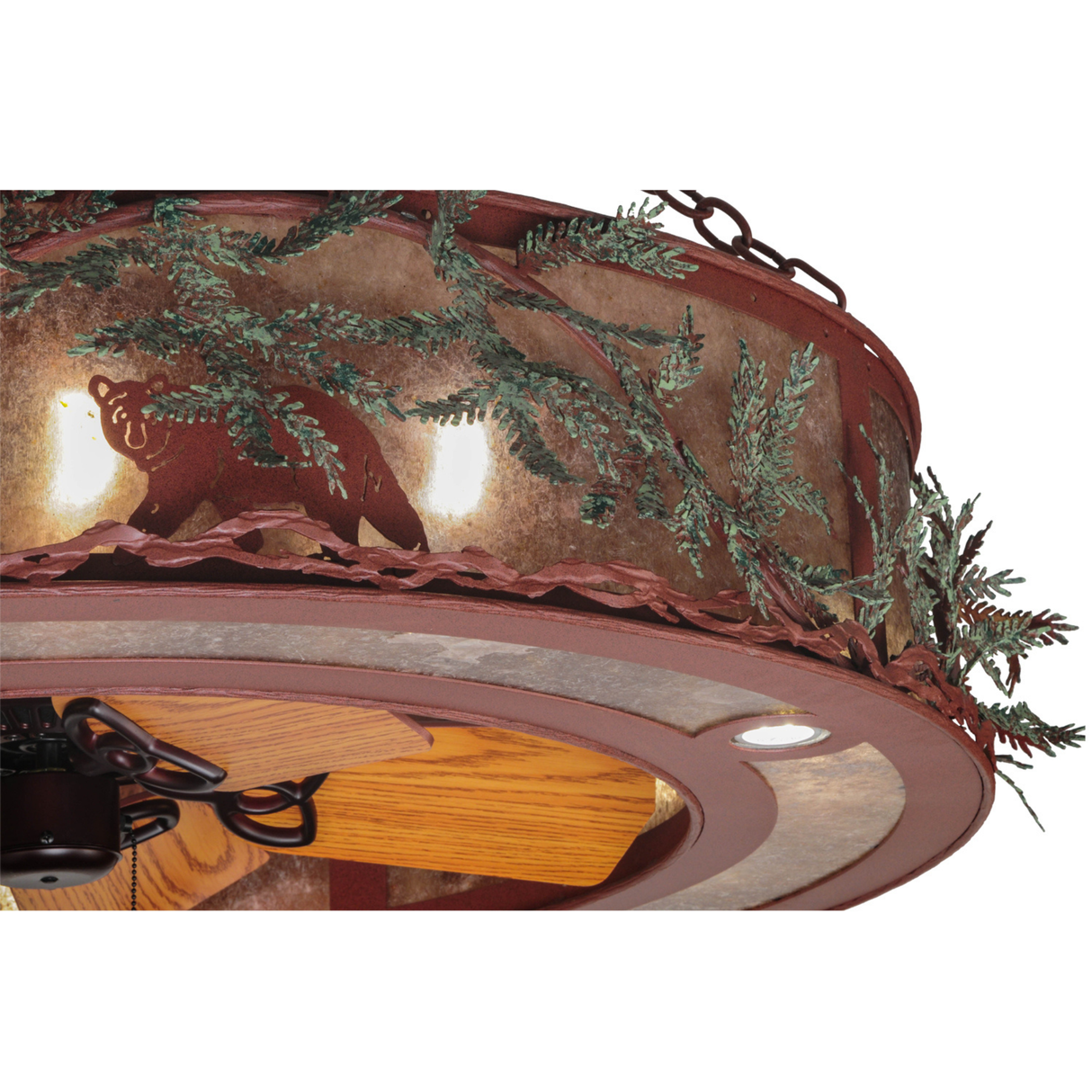 Closeup of illuminated bear silhouette and textured pine branch trim.