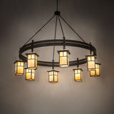 Illuminated chandelier with warm beige glass glow in dark room setting.